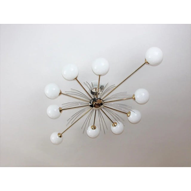 Vintage Chandelier in the style of Stilnovo, 1970s, in Very Good conditions. Designed 1960 to 1969 This piece is...