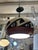 Vintage ceramic pendant light featuring a bold Southwest-inspired geometric design. The rounded globe form showcases...