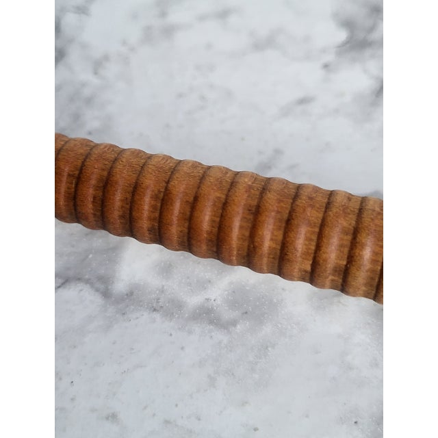 Vintage wood carved and copper candle snuffer. It has a etched and coiled design and looks Danish.