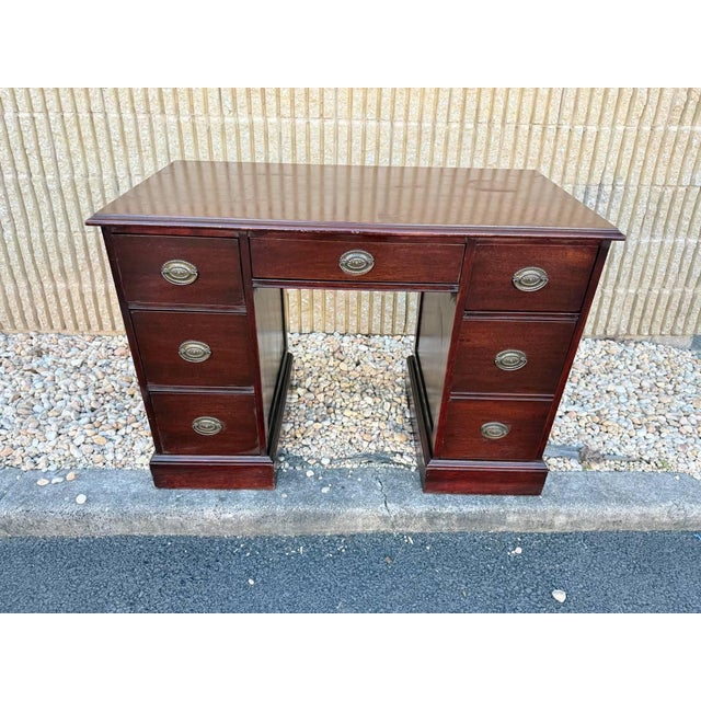 Vintage Victorian Style Mahogany Twin Pedestal Writing Desk. It features three drawers on each side with a central drawer...