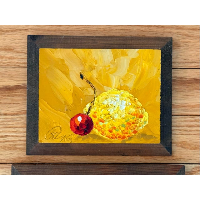 Trio of fruit still life paintings with thick impasto texture. Charming and cheerful. Paintings are mounted or "framed" on...