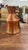An impressive antique handcrafted pitcher featuring a hand-hammered copper body with rich rustic patina, a flared base,...