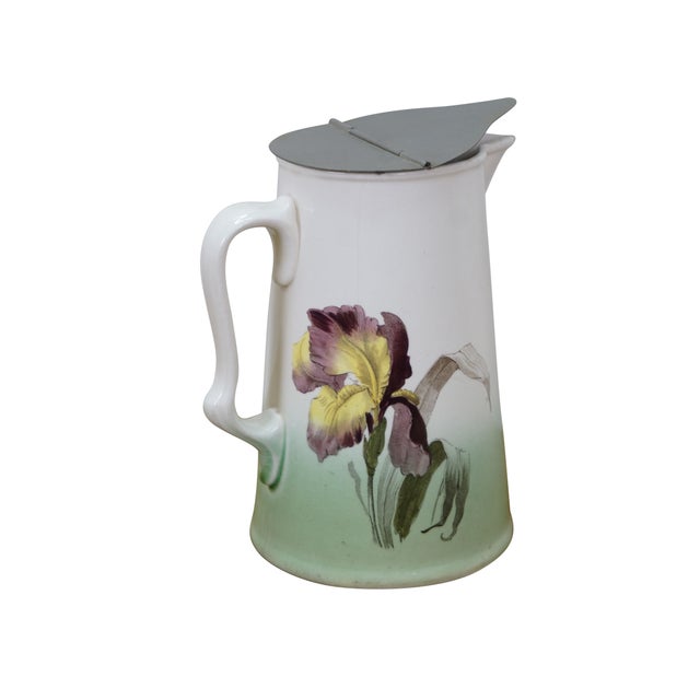 Circa early 20th century Villeroy & Boch Iris lidded pitcher / jug. Tapered cylindrical white porcelain body with ear...
