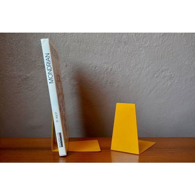 with their minimalist design and striking color, these vintage 1960s bookends are sure to make a statement on your...