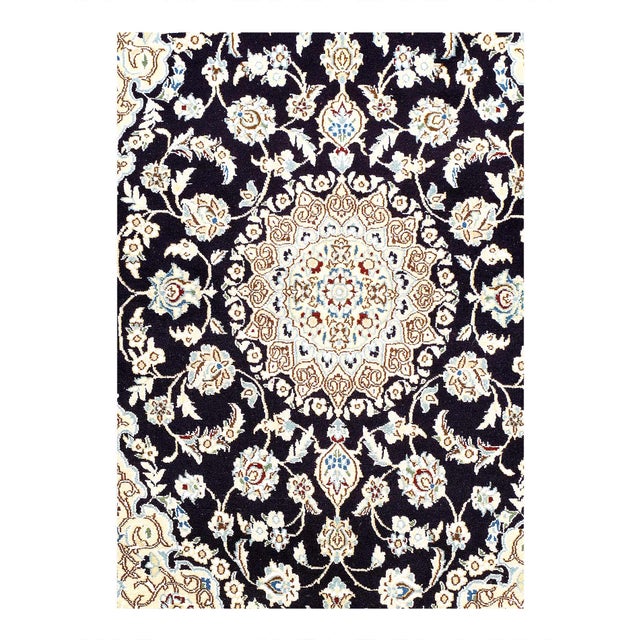 A hand-knotted, The rug that features gorgeous wool and silk and an ornate, tan and dark blue -ish field. D08172