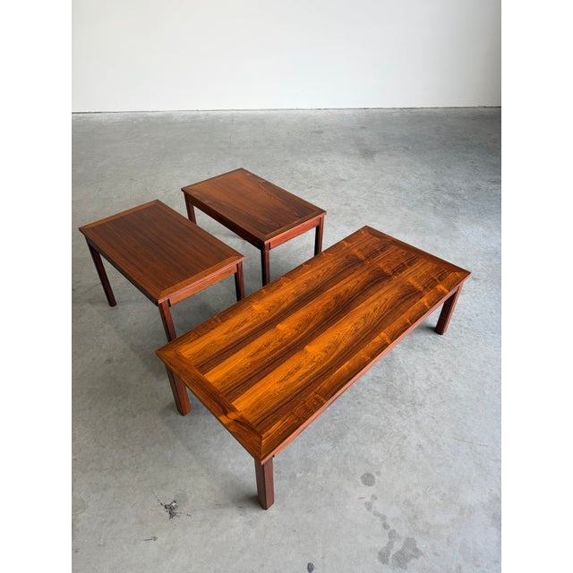 Mid Century 1970’s Rosewood Coffee Table and Two matching Side End Tables. Lovely bookmatched rosewood veneer tops and...