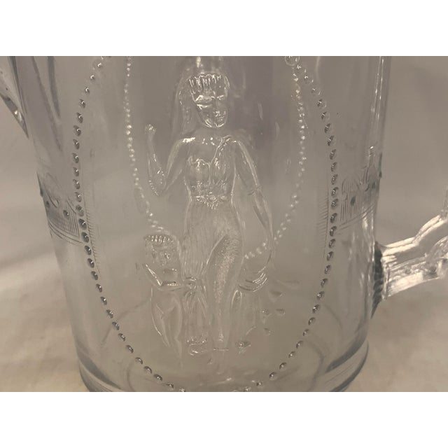 19th Century Richards & Hartley "The Guardian" No. 500 Cupid and Venus Flint Glass Pitcher for your consideration. The...