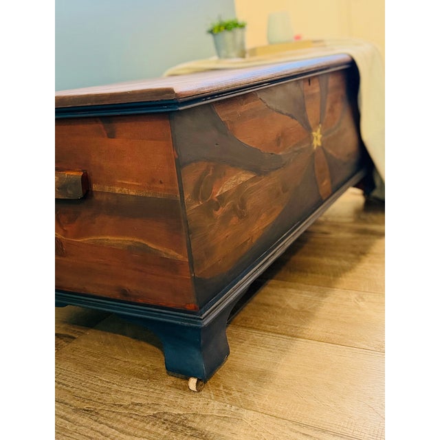 Beautifully refinished Cedar Chest featuring a Refinished Cedar Chest hand-painted floral-inspired design in rich walnut...