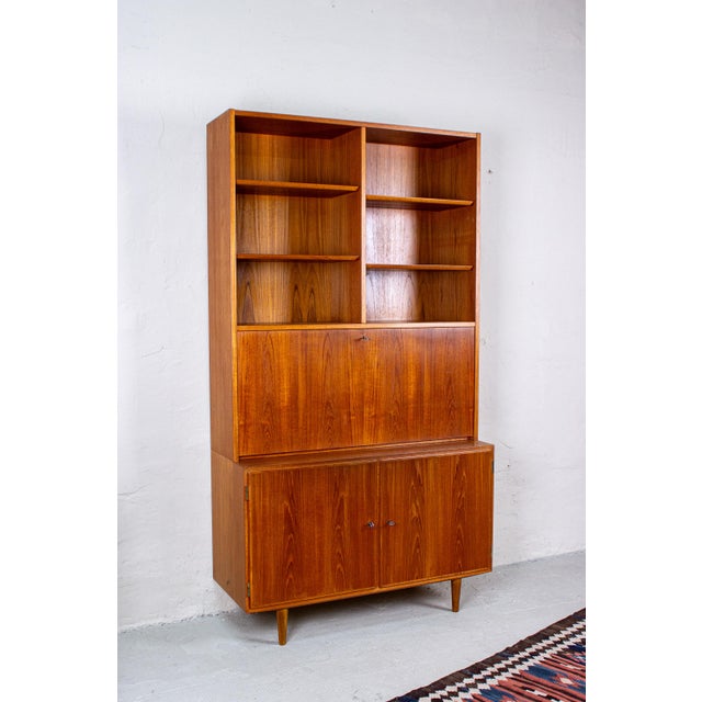 A simple, functional secretary desk by hundevad, made in denmark. This piece of furniture combines clean lines with a warm...