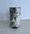 A soda fired porcelain vase that features a shell and rope motif in a striking black and white finish. It’s a nice piece...