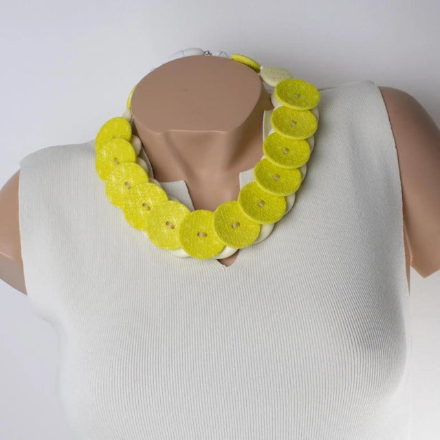 Handcrafted in Italy, this gorgeous Angela Caputi resin choker necklace features a yellow citrus tone with banana and...