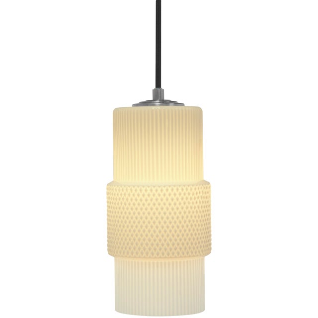 Hand-blown in Venice, Italy, the Mimo Cylinder Pendant Light by Oggetti features a clean, architectural silhouette that...
