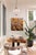 Ignite features a vibrant depiction of aspen trees, their white trunks contrasting against a backdrop of warm golden...