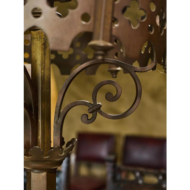 An exceptional pair of monumental candlesticks in the neo-Gothic style, made of bronze. The precise blacksmithing and...