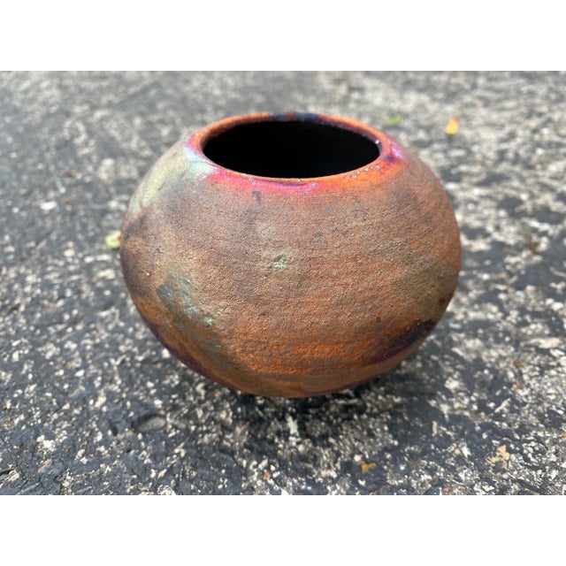 Small Raku pot which we believe to have been made by J Berndt. Gorgeous color variations on a skillfully made delicate...