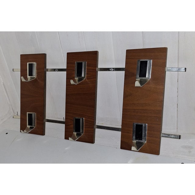 Vintage Wall-Mounted Coat Rack in Teak and Aluminum, 1970s, in Very Good conditions. Designed 1970 to 1979