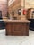This antique solid oak counter has been fully restored. Its front is adorned with geometric moldings. On the back, it...