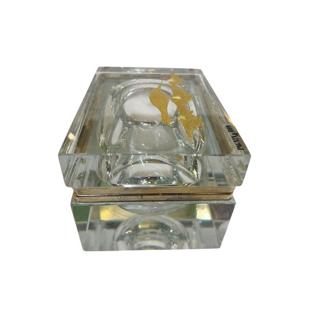 A striking Murano glass box featuring a finely detailed gold pheasant, beautifully rendered within the glass. The rich...