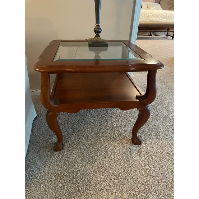 Pennsylvania House's excellent craftsmanship and iconic cherry wood on full display. Glass top, ball and claw feet, extra...