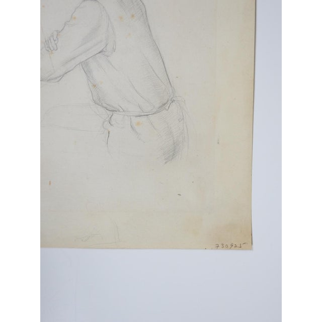 Early 20th century pencil on paper drawing of seated woman. Unsigned. Unframed, age toning, some foxing and corner...