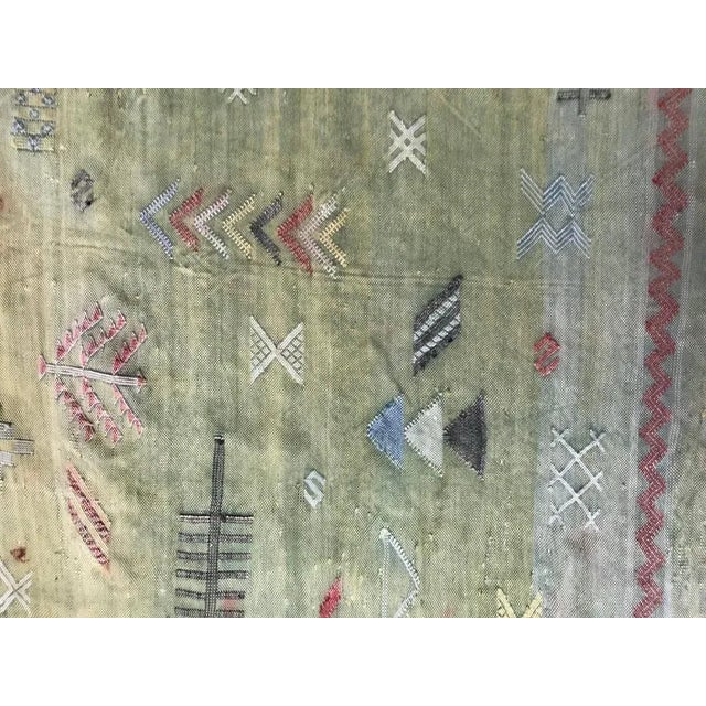 A very beautiful tribal Moroccan rug with a naive tribal design, and a green field. Entirely handwoven with silk on silk...