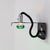 Painted metal wall lamp with upward or downward adjustable bulb, model “Squadra” designed by Ezio Didone and produced by...