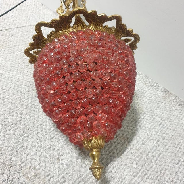 This is a fabulous gilt brass lantern with hanging leaf detail chains, small cranberry glass beads for the shade, in...
