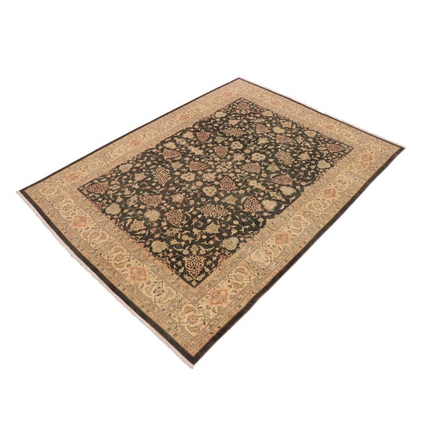 Enhance the ambiance of your home with this magnificent Persian-influenced Turkish hand-knotted rug made by skilled...