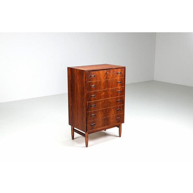 Large Scandinavian chest of drawers produced in Denmark, 1960. A refined and timeless mid-century modern design, combining...