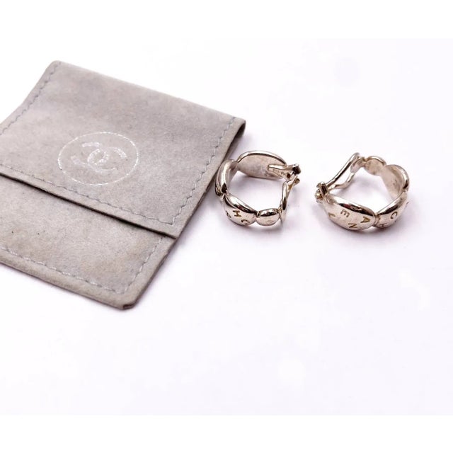 Chanel 925 Sterling Silver Letter Hoop Earrings *Marked 925 and stamped *Comes with the original dustbag -Approximately...