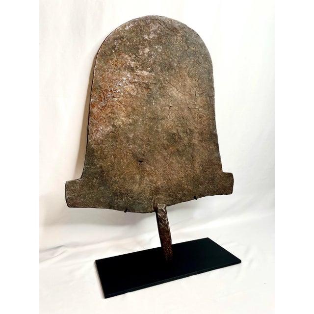 A large sculptural iron currency hoe from the Afo people of Nigeria. Iron was a precious and valuable commodity throughout...