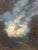 A charming small vintage oil painting depicting a dramatic cloud-filled sky rendered in rich shades of blue and white. The...