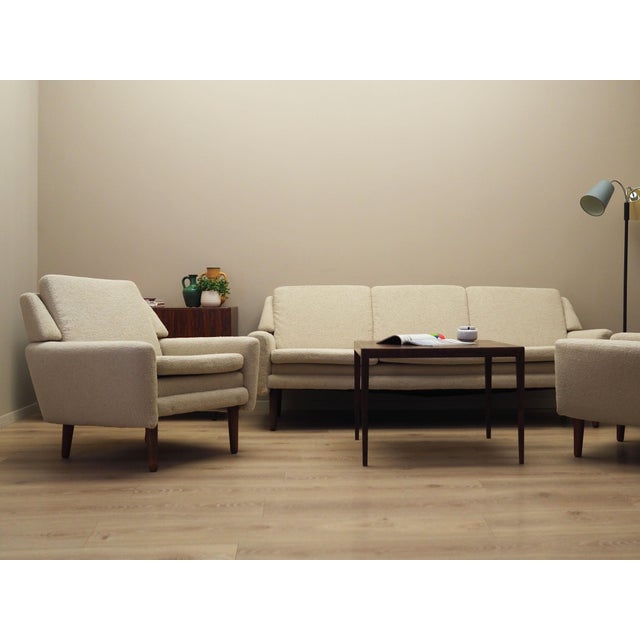 The armchair was made in the 1970s, Danish production. The structure was made of solid wood. Legs made of solid rosewood....