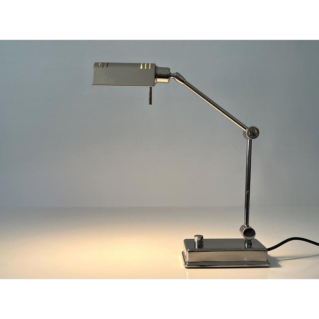 Elegant and adjustable vintage brass desk light. with adjustable arm and rotating lamp shade. Designed and manufactured by...