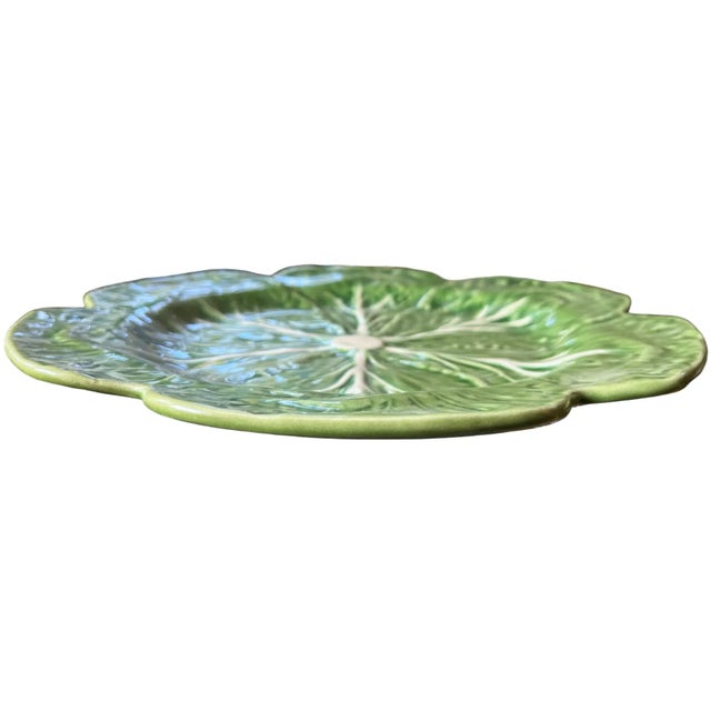 A classic green cabbage charger or platter by Bordallo Pinheiro, featuring the brand’s iconic naturalistic modeling and...