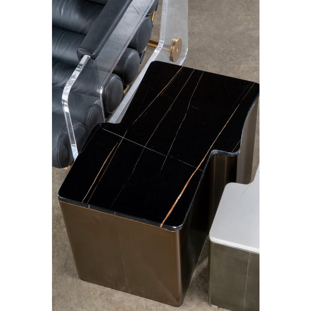 The playful irregular shape paired with chic black and bronze tones creates a modern masterpiece end and side table that...