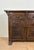 Striking Spanish sideboard cabinet crafted in solid oak, featuring rich hand-carved decoration throughout the façade. The...
