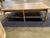- Hand turned, solid wood legs and cross members - Solid wood top - Veg tan woven leather shelf - Wood: White Oak -...