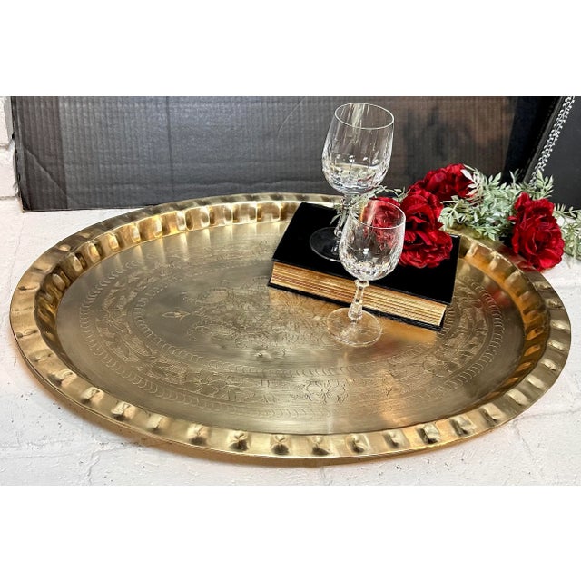This is for a wonderful very large Solid Brass Tray. It is oval in shape and measures: 26 inches X 19 deep X 1.5 inches...