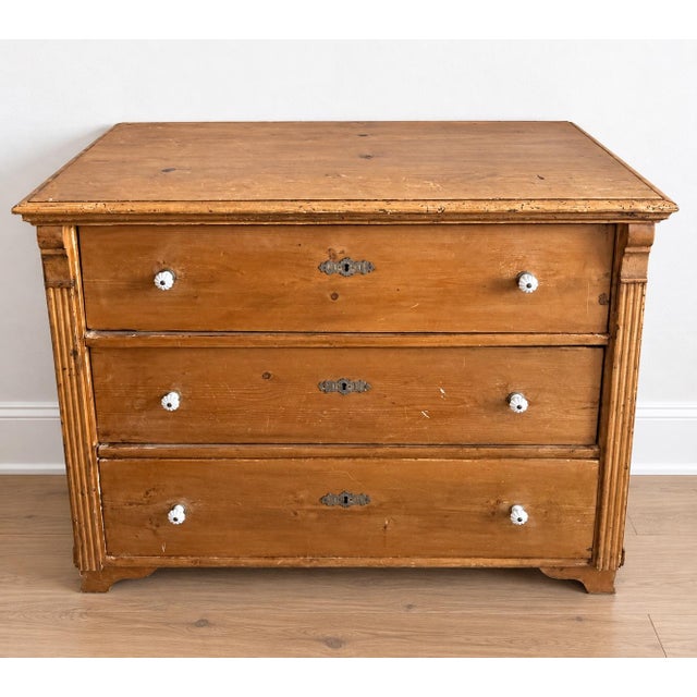 Charming antique pine three-drawer chest featuring a beautifully aged, warm honey-toned finish and loads of authentic...