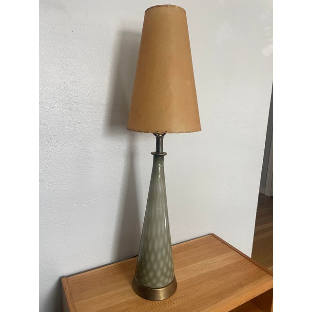 This genuine Empoli glass lamp stands an impressive 38" tall and immediately reads as a sculptural statement piece. The...