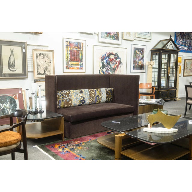 A John Saladino high back sofa. This is a gorgeous modern accent sofa. This piece is upholstered with a beautiful brown...