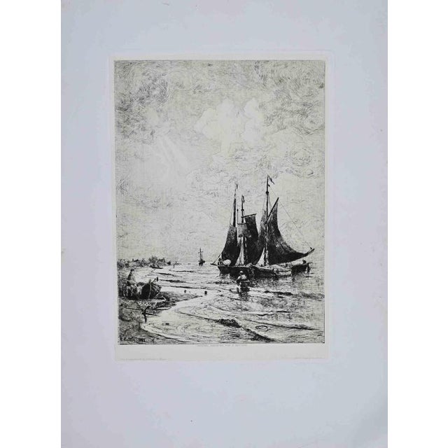 Original etching on paper depicting a tranquil coastal scene with fishing vessels moored in shallow waters at low tide....