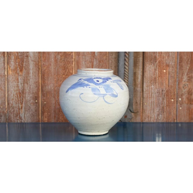 Lovely Vintage Porcelain Jar with blue foliage designs on a white glazed background featuring a globular shape & aged finish.