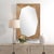 The Marquise Mirror Features A Diamond Shaped Profile Showcasing A Concaved Natural Wood Frame With A Subtle Light Gray...