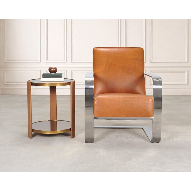 Remarkable English equestrian saddlery inspired two-tier side or drinks table designed by Ralph Lauren. The refined table...