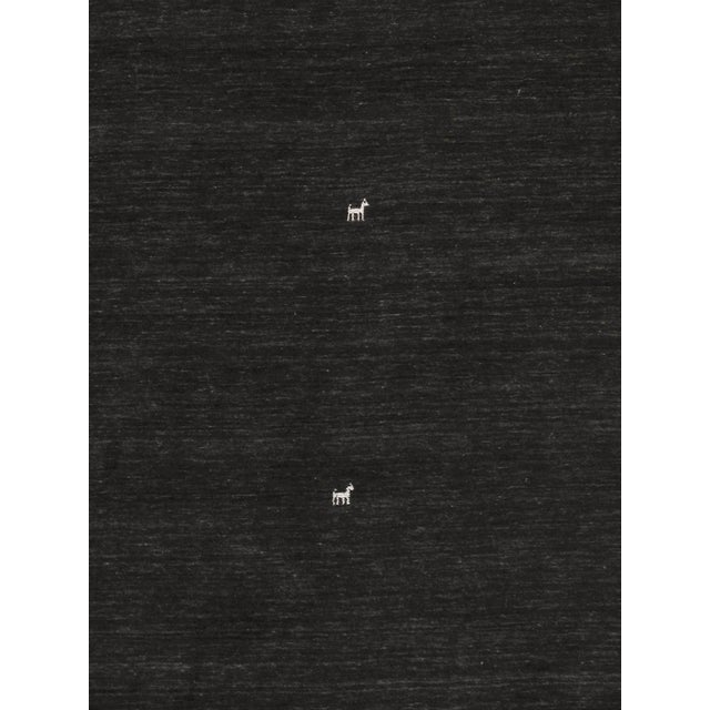 The tribal motifs of this traditional area rug collection reflect the soft pile and unparalleled elegance of classic...