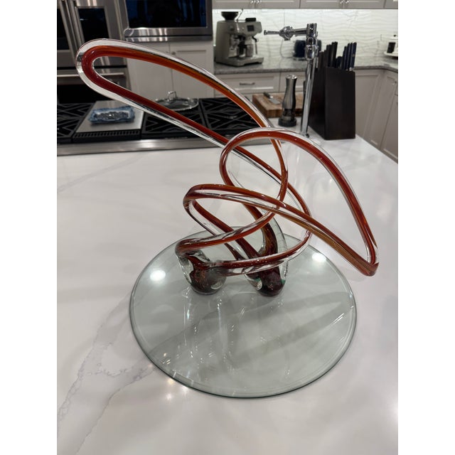 Scott Hartley is a master American glassblower and the founder of Infinity Art Glass, a widely recognized studio and...