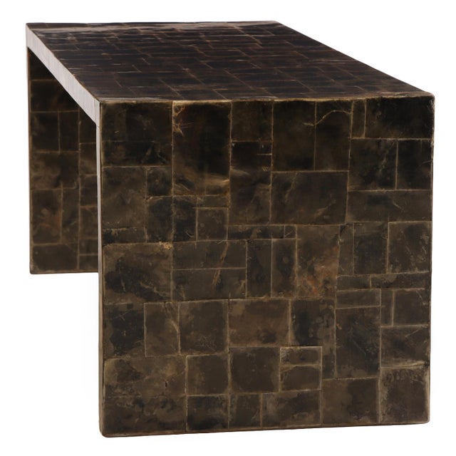 The rectangular top finely inlaid with a shimmering marquetry surface of natural mica, displaying subtle black, brown, and...