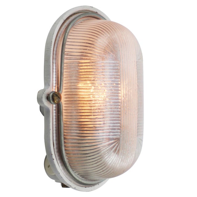 French industrial wall / ceiling lamp by mapelec, amiens, france cast iron back with clear striped glass. e27 / e26 this...